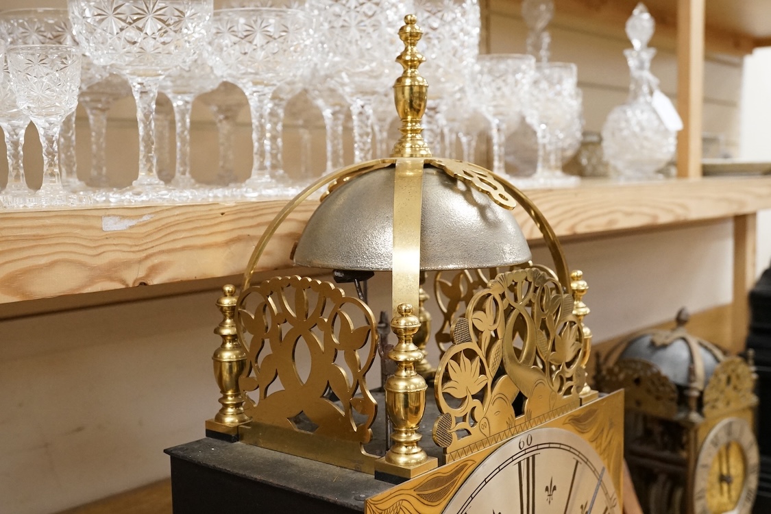 A large lantern style wall clock, 60cm high